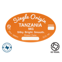 Load image into Gallery viewer, This Amazing Coffee comes from a Cuevas Coffee Partner Neumann Kaffee Gruppe (NKG) Located in Mbeya, Mbozi at an elevation of 1,700-1800m, this AA 100% Arabica coffee produces an Earthy Aroma with the distinct flavors of Tangerine and Black Tea. This coffee also exudes a silky body with bright acidity. At Cuevas Coffee Roasters we roast this to a medium roast to bring out the unique flavor profiles of the coffee for an outstanding cup!